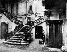 The Grand Staircase at Endcliffe Hall. The wrought iron balusters and mahogany handrails were made at John Jebson Smith's Roscoe Works. Note the half-round top doors at each side of the staircase. These led to the domestic quarters, 'below stairs'
