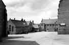View: s24699 Anns Grove Nursery, Infant and Junior School (formerly Anns Road County School) looking across Anns Road towards St. Andrews Methodist Church, Sunday School