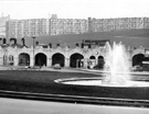 View: s29425 Sheffield Midland railway station, Sheaf Street  after cleaning with Sheaf Square fountain in the foreground and Park Hill Flats inm the background