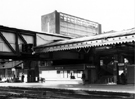 View: s29454 Platform 1 from platform 2, Sheffield Midland railway station, Sheaf Street with Sheaf House in the background 