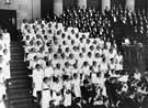 View: s29575 Unspecified choir performing at the City Hall showing one of the City Hall Lions (right)