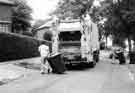 Refuse collection on Lees Hall Avenue showing wheelie bins