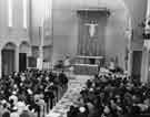 Service inside St. Theresa's Roman Catholic Church, junction of Prince of Wales Road and Queen Mary Road, Manor