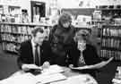 View: s31940 Richard Caborn, with Mrs Caborn, judging paintings in the Children's Library, Central Library, Surrey Street