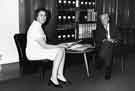 John Bebbington, City Librarian, with his secretary Edna Jessop on his retirement, Central Library, Surrey Street