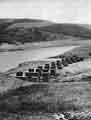 Derwent Reservoir showing pillars of old railway used to carry materials to build the viaducts