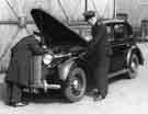 Police work - Policemen checking under the bonnet of a taxi, Sheffield City Police