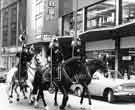 Mounted police in dress uniform parading in the City Centre