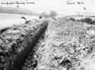 Trench through a field near Hazelbarrow Farm, Norton