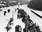 Commuters waiting at Dore and Totley railway station, Abbeydale Road South during severe weather when buses were taken off the roads.