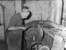 Polishing scraper handles at R. Bingham, scrapers and grinders, Court 15, Hollis Croft