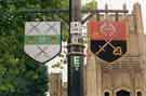 Heraldic banners on lamp posts outside Sheffield Cathedral