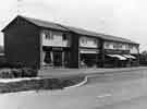 Shops and flats on Causeway Head Road, Dore showing (left to right) Rene's, ladies hairdressers (No.34); Cawood of Dore, drapers (No.32); Gowers and Burgons, grocers (No.28) and A.E.Clayton, fishmongers (No.26)