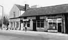 Shops on Chapel Street, Woodhouse showing (left to right) Woodhouse Motor Parts, motor accessories; J.Hardcastle and Son; E.M.Evans, gents hairdresser 