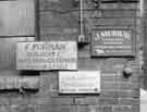 Work shop signs for F. Foreman Builders Ltd, interior and exterior decorators; J. Murray, spring knife grinder and S.D.Williams, tailoress, Butcher Works, No.72 Arundel Street
