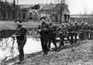14th King's Own Yorkshire Light Infantry (KOYLI) on patrol in the village of Elst, Holland