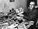 Harold Booth, Sheffield City Libraries' photographer, pictured with the Rivelin Valley Survey photographs