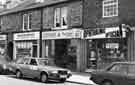 Shops on High Street, Mosborough showing from left to right K. M. and D. M. Hopkins, bakers and confectioners; Maynards, chartered surveyors and estate agents; the Derbyshire Building Society and Ian Van Hoof, opticians
