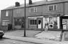 Shops on Jeffcock Road, High Green showing (left to right) Grandstand Racing, Lewis Wadsworth, estate agents and G. H. Fox, newsagents