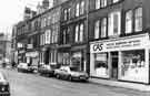 View: s38619 London Road, Sharrow showing (right to left) Central Appliance Services, washing machine repairs and Highfield Exchange, second hand goods dealers