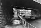 London Road at Heeley Bottom showing Heeley Railway Bridge and (centre) H. Ponsford Ltd, furniture dealers (Nos.577-609)