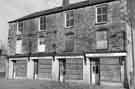 Derelict shops, Market Street, Woodhouse showing (left to right) Winifred Camden (No.3), ladies outfitter; Audrey's Flower Centre and D. J. Tomlinson Ltd, chemists