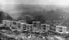 Construction of houses on the Rollestone Estate looking across Leeshall Wood towards Norton