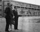 View: s40284 Visit of Mr Inam Aziz, editor of the Jang newspaper in Karachi, Pakistan (right) with Mr F. Codd (left), deputy housing officer and Mrs J F Demers (centre) viewing Park Hill Flats (