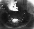 Swift Levick and Sons Ltd., steel manufacturers, Clarence Steel Works, Foley Street showing molten steel running from the ladle into ingot molds, c. 1960 Swift Levick and Sons Ltd., steel manufacturers, Clarence Steel Works, Foley Street showing molten steel running from the ladle into ingot molds, c. 1960