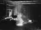 Tapping 100 tons of steel from an open hearth furnace into a waiting ladle, Templeborough Melting Shop, Steel, Peech and Tozer Ltd., c.1960
