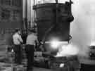 Teeming a ladle of molten steel into ingot moulds in the No. 3 melting shop, Samuel Fox and Co. Ltd., Stocksbridge Works, c.1960
