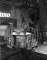 A load of scrap is on the point of being discharged from the charging bracket into the body of the 70 ton electric arc furnace, Samuel Fox and Co. Ltd., Stocksbridge Works, c.1960