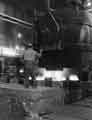 Uphill teeming of 50 cwt. ingots. In the background (left) is the 80 ton electric arc furnace, Samuel Fox and Co. Ltd., Stocksbridge Works, c.1960
