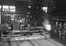 Withdrawing heated block before forging of a railway wheel, Steel, Peech and Tozer Ltd., Templeborough Works, Templeborough Withdrawing heated block before forging of a railway wheel, Steel, Peech and Tozer Ltd., Templeborough Works, Templeborough