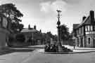 View: s41666 Woodhouse stocks and market cross, Market Place, Woodhouse showing (right) the Royal Hotel (No.10)