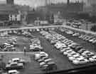 Corn Exchange car park showing (back l.to r.) Newmarket Hotel, No 20, Broad Street and No 1, Sheaf Street ; Granelli Brothers, confectioners and ice cream makers (No.26 Broad Street); and (far left) W.H.Benson Ltd., carpet dealers (No.32)