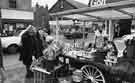 Market stall at Hillsborogh showing Henry Wigfall Ltd., Nos.34-36 Middlewood Road (centre) and Wilcock Brothers Ltd, furniture dealers (Nos.38-42) (left)
