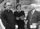 Mr Albert Staley (right) presents a copy of his book to (centre) Pat Coleman, Head of Sheffield Libraries with Rev Alan Billings looking on (left) 