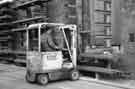Fork lift truck lifting steel rods at Sanderson Kayser Ltd., Attercliffe Steel Works, Newhall Road 