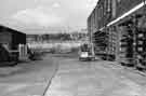 Fork lift truck lifting steel rods at Sanderson Kayser Ltd., Attercliffe Steel Works, Newhall Road 