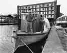 View: s42642 Moored boat at the Sheffield Canal Basin showing Straddle Warehouse (behind)