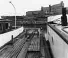 View: s42643 Moored boat at the Sheffield Canal Basin showing Hyde Park Flats (behind)