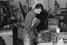 Gigging the cutlery before polishing at Hiram Wild Ltd., cutlery manufacturers, Central Works, Herries Road, Shirecliffe