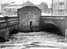 River Don in flood at confluence with the River Sheaf at junction of Blonk Street and Castlegate showing (centre) public lavatories
