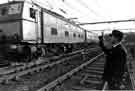 Station supervisor Stanley Mercer waves off one of the last passenger trains to leave Sheffield Victoria Station.