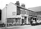 Shops on Broomhall Street at the junction of Hanover Square showing (l.to r.) No.207 Broomhall Sale Room, used furniture dealers, No.209 Jonathan Maw and Son, boot makers and No. 211 G.Fyne, fancy goods merchants