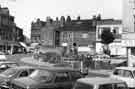 Devonshire Street showing (left) junction with Fitzwilliam Street and Nos. 8 - 10 Neville Watts of Sheffield. architectural and builders ironmongery