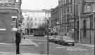 View: s44694 Junction of (left) Burgess Street and Cross Burgess Street showing (centre) the Town Hall extension (Egg Box (Eggbox)) and buildings on St. Paul's Parade