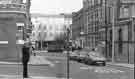 View: s44694 Junction of (left) Burgess Street and Cross Burgess Street showing (centre) the Town Hall extension (Egg Box (Eggbox)) and buildings on St.Paul's Parade