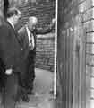 Joe Street (City Engineers Department) and Bert Hawley (Dangerous Structures section) inspect a wall at No. 42 Nicholson Road, Heeley Joe Street (City Engineers Department) and Bert Hawley (Dangerous Structures section) inspect a wall at No. 42 Nicholson Road, Heeley